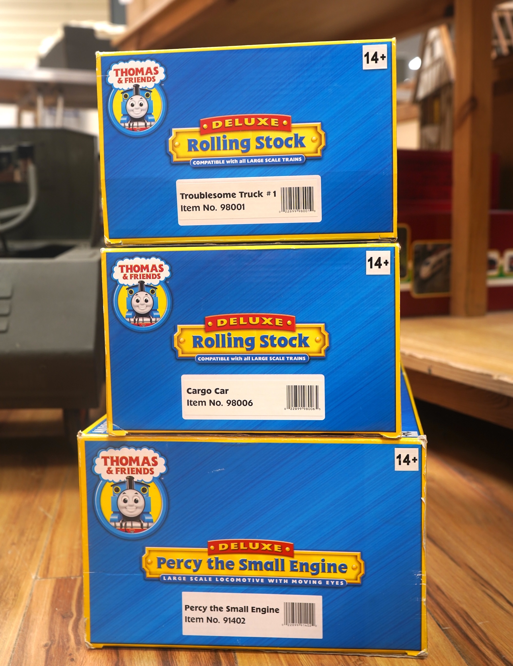 Three boxed Bachmann G gauge (45mm gauge) Thomas the Tank Engine items; Percy the Small Engine (91402), a Cargo Car (98006) and a Troublesome Truck (98001). Condition - good.